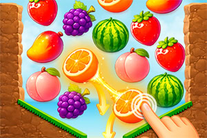 Bunte Früchte wie Erdbeeren, Trauben, Wassermelonen, Mangos und Orangen auf einem Spielfeld, mit einer Hand, die eine Orange antippt