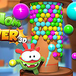 Om Nom neben einem Turm aus bunten Kugeln im Spiel Om Nom Tower 3D